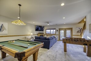 Huge game room with foosball, pool, and large smart 75" TV (plus cable tv)!
