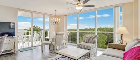 Floor to ceiling windows grace this beautiful 3rd floor Lovers Key Resort condo, flooding the space with sunlight and bay views.