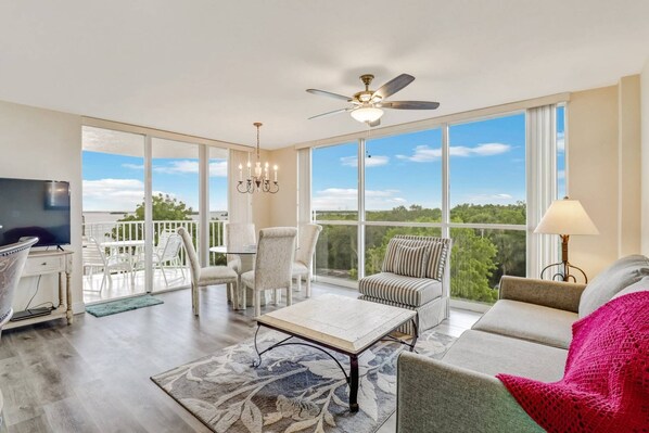 Floor to ceiling windows grace this beautiful 3rd floor Lovers Key Resort condo, flooding the space with sunlight and bay views.