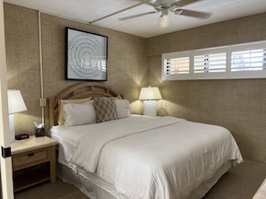 King size bed with large closet, 2 side tables, and dresser