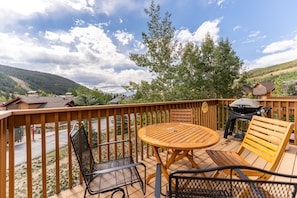 Large private balcony with new outdoor furniture.