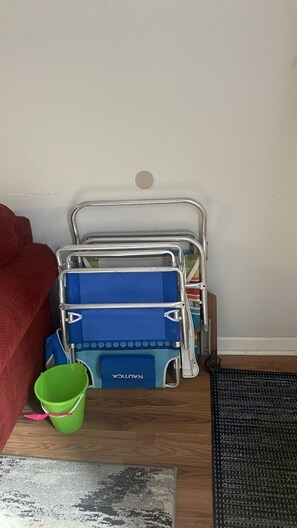 2 beach chairs, a bucket and a shovel, and a cooler bag available for use 