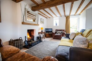 The sitting room with patio door onto the garden.