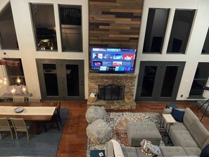 Huge great room for entertaining. 82" TV and Sonos in-ceiling speakers.