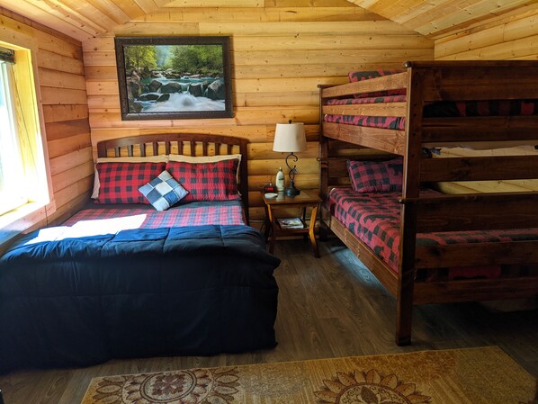 Snuggle in the comforter on the full bed or claim the top bunk bed for yourself.