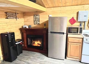Relax in front of the fire and sip chai tea using the hot/cold water dispenser.