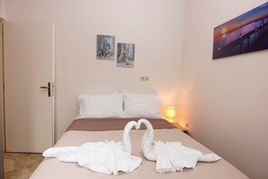 Experience coziness in the second bedroom, adorned with a welcoming double bed