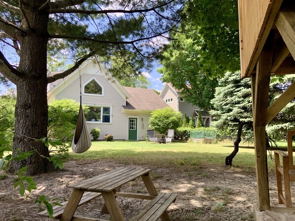 Looking back at the house from the sandbox