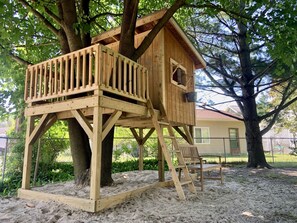 Treehouse, sandbox, bucket-pulley system