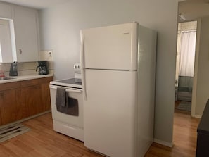 kitchen appliances - coffee maker, fridge/freezer, stove, microwave