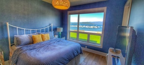 Master bedroom with lake and mountain views as well as access to the balcony.