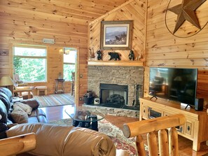 The Perfect Cabin Décor Compliments this Stunning Cabin with Stone Gas Fireplace