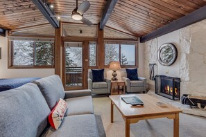 Living room with wood-burning fireplace