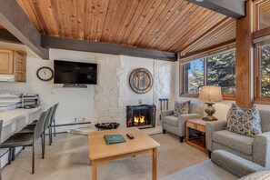 Living room with wood-burning fireplace