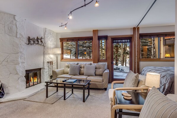 Living room with wood-burning fireplace