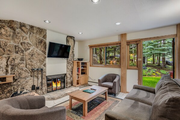 Living room with wood-burning fireplace