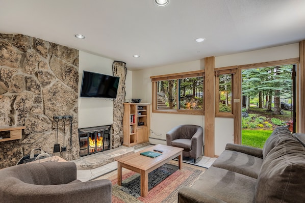 Living room with wood-burning fireplace