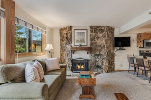 Living room with wood-burning fireplace