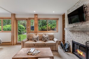 Living room with wood-burning fireplace