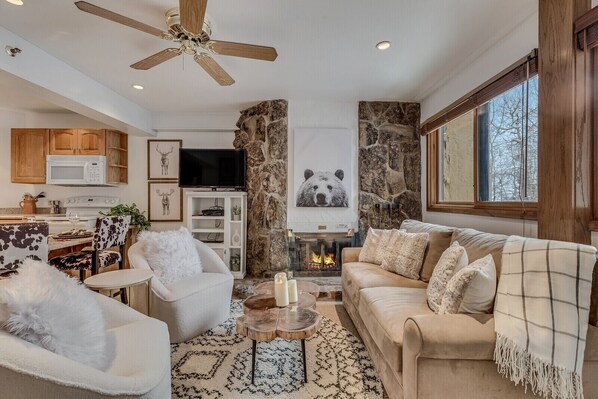 Living room with wood-burning fireplace