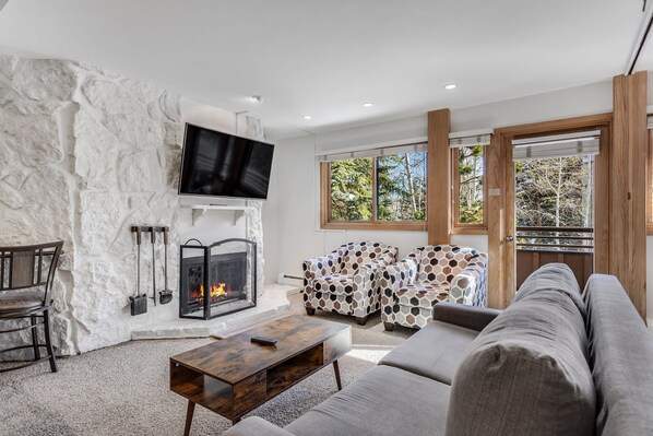 Living room with wood-burning fireplace