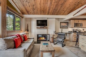 Living room with wood-burning fireplace