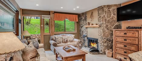Living room with wood-burning fireplace