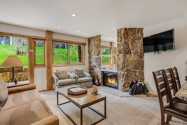 Living room with wood-burning fireplace