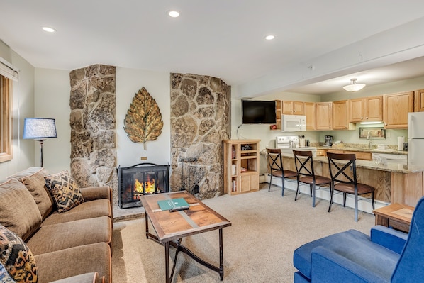 Living room with wood-burning fireplace