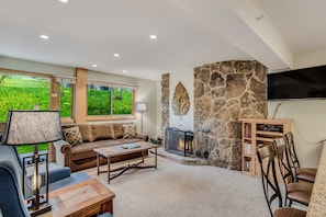 Living room with wood-burning fireplace