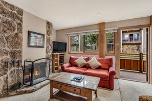 Living room with wood-burning fireplace