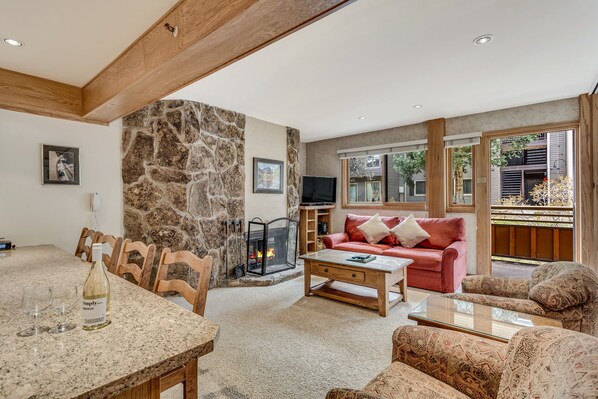 Living room with wood-burning fireplace