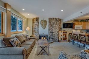 Living room with a wood-burning fireplace