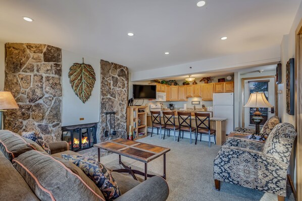 Living room with a wood-burning fireplace