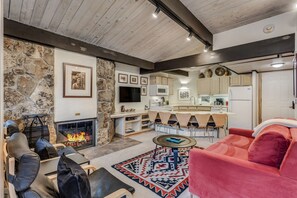 Living room with wood-burning fireplace