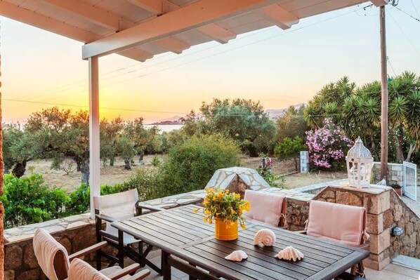 Patio in an olive grove with sunset views