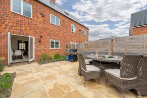 Acorn Cottage, Holt:  Enclosed, south facing courtyard garden with furniture with seating for six guests and gas barbecue