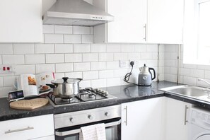 In our kitchen you'll find an electric stove, kettle, oven & washing machine