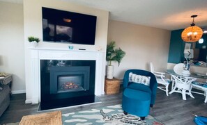 Enjoy the fireplace, sound of waves, and a great book or movie on 55in TV.