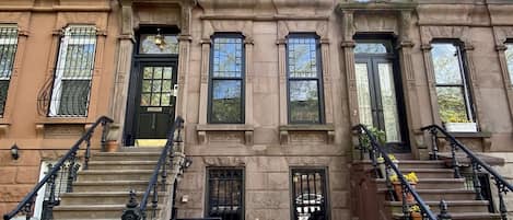 Historic brownstone of leafy block