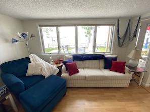 The white couch folds out into a bed.