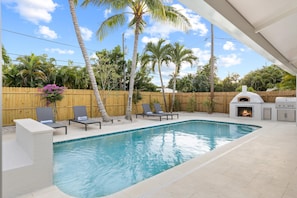 Heated pool area with waterfall feature. Fenced in backyard to ensure privacy.