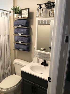 Fresh towels for your use, there is a blow dryer under the sink.