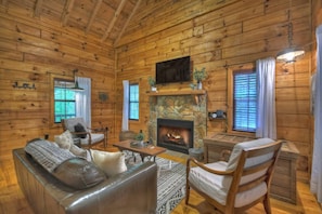 Living Room with wood burning fireplace and Smart TV