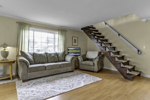 The floating staircase leads you from the living room to the second floor loft.