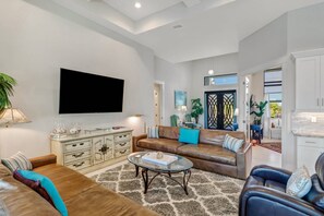 A wall mounted Smart TV is located in the living area, perfect for a night of TV viewing.