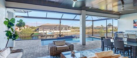 Experience year-round outdoor living in this home with spacious screened lanai, heated pool, and sundeck.