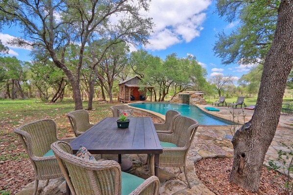 Table with seating for six next to the pool