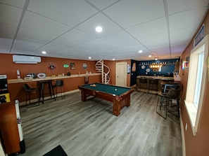 Newly renovated Bar & Game room featuring a custom made Olhausen pool table.