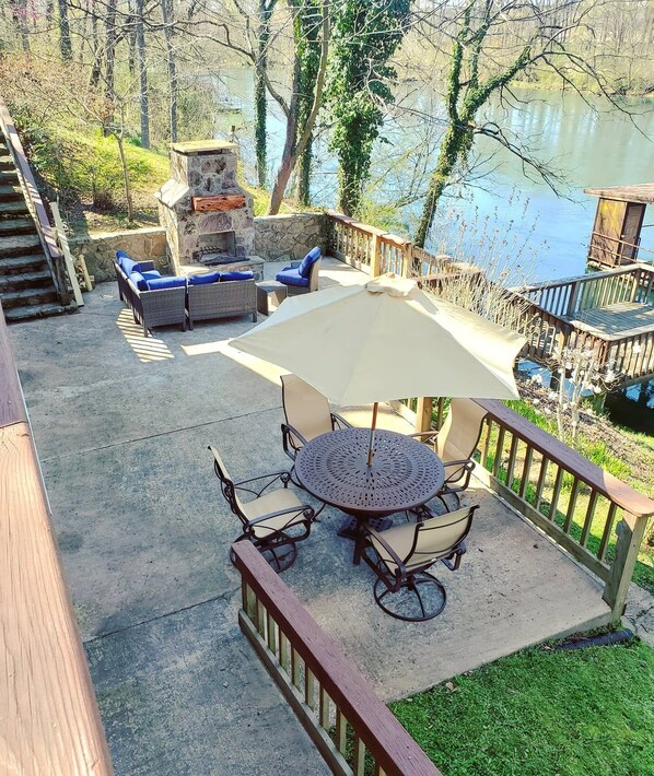 Patio with Beautiful Stone Fireplace and Outdoor Dining Table 